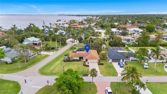 birds eye view of property featuring a water view