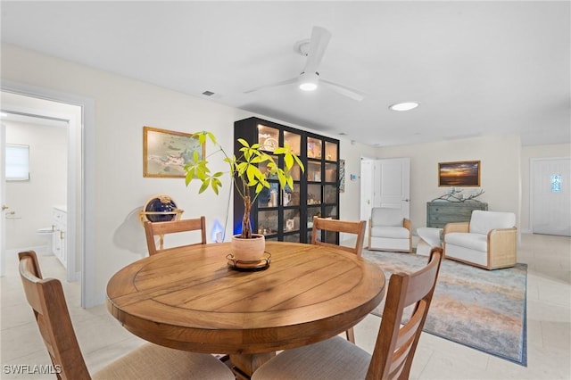 dining space featuring ceiling fan