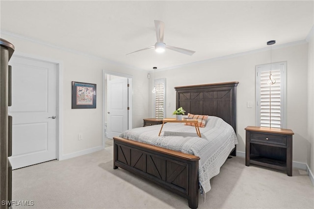 carpeted bedroom featuring crown molding and ceiling fan