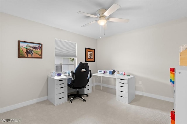 home office featuring light colored carpet and ceiling fan