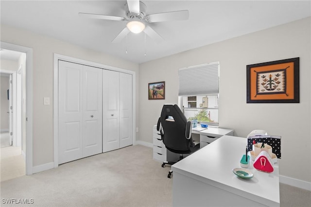 carpeted office with ceiling fan