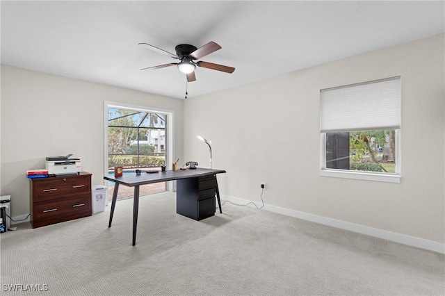 carpeted office with ceiling fan