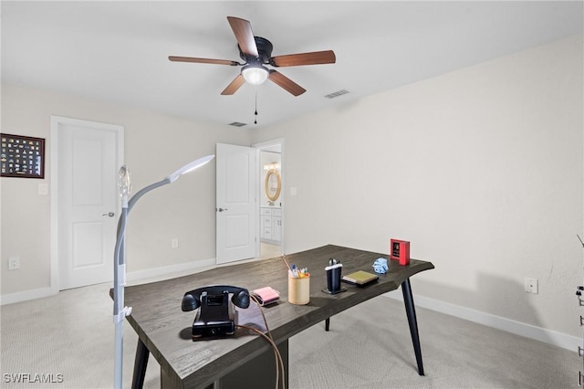 carpeted office with ceiling fan