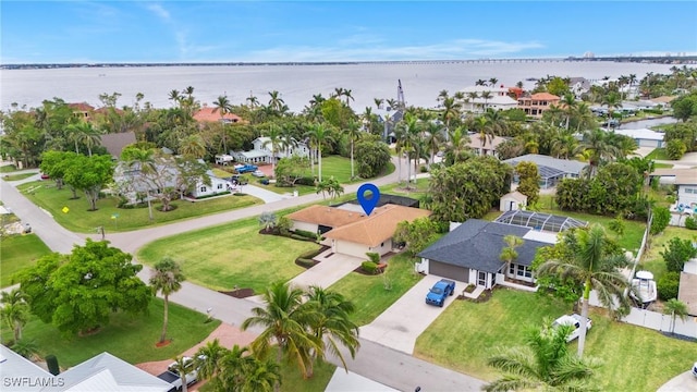 birds eye view of property featuring a water view