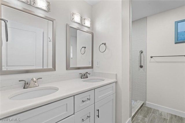 bathroom featuring vanity and a shower