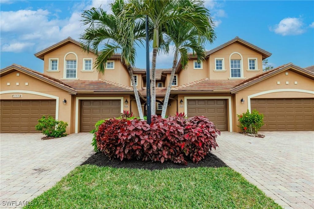 view of front of property with a garage