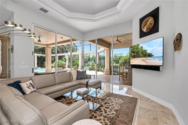 interior space featuring ceiling fan and a tray ceiling