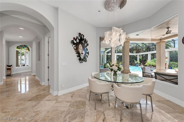 dining space featuring ceiling fan and a wealth of natural light