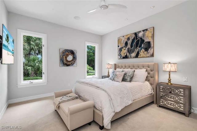 bedroom with ceiling fan and light colored carpet