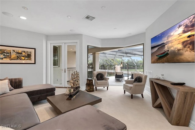 living room featuring light colored carpet