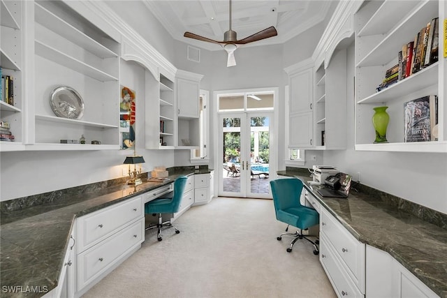 office space featuring built in desk, light colored carpet, french doors, and coffered ceiling