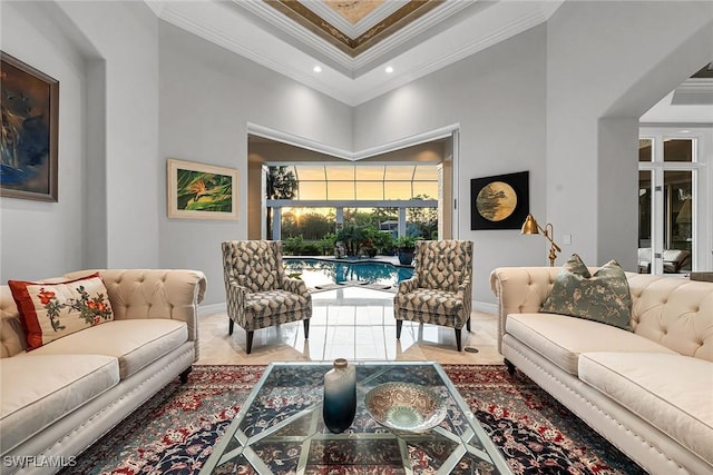 living room featuring a towering ceiling and crown molding