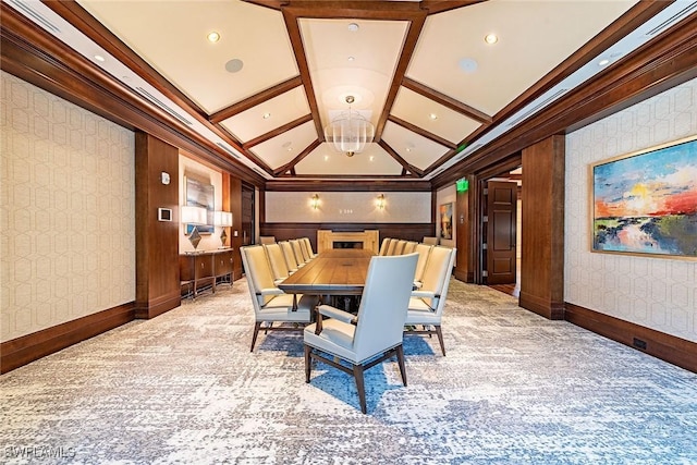 carpeted dining area featuring coffered ceiling and crown molding