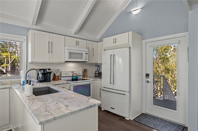 kitchen featuring decorative backsplash, light stone countertops, dark hardwood / wood-style flooring, white appliances, and white cabinets