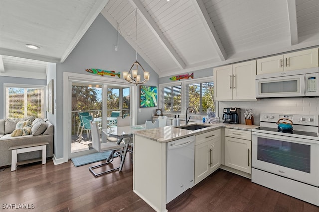 kitchen featuring sink, backsplash, a chandelier, white appliances, and white cabinets