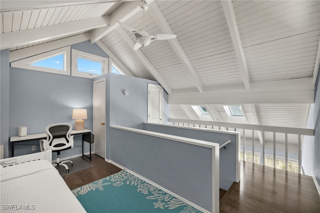 office with ceiling fan, dark wood-type flooring, and vaulted ceiling with skylight