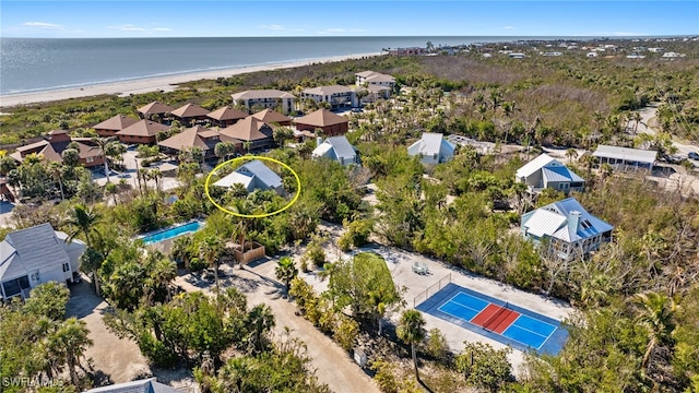 bird's eye view featuring a view of the beach and a water view