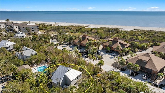 bird's eye view with a beach view and a water view