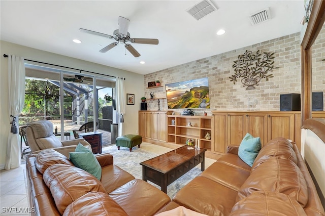 living room with brick wall and light tile patterned flooring