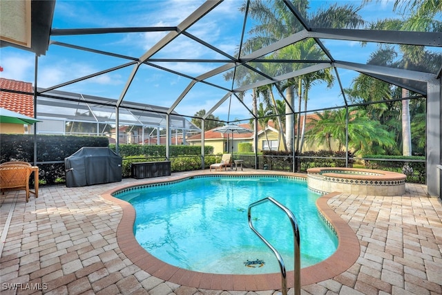 view of swimming pool featuring a lanai, a patio area, a grill, and an in ground hot tub