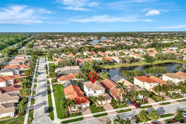 birds eye view of property featuring a water view