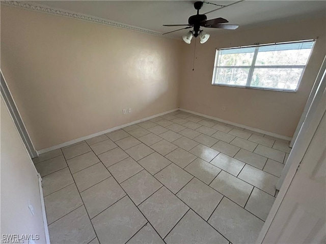 tiled empty room with ceiling fan