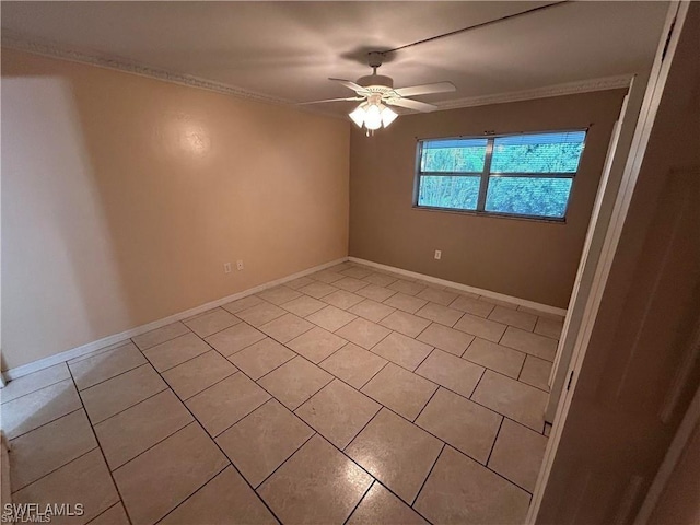 spare room with light tile patterned floors, ceiling fan, and ornamental molding