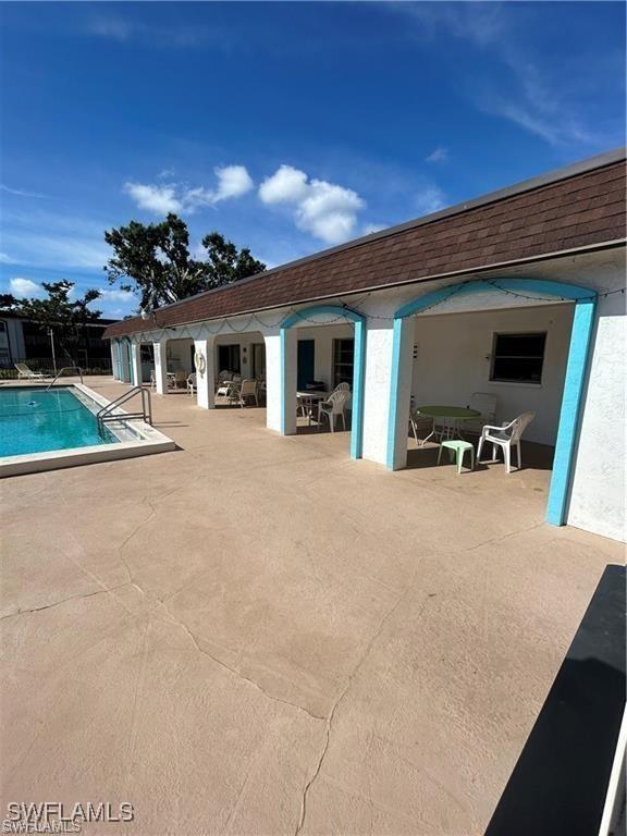 view of pool featuring a patio