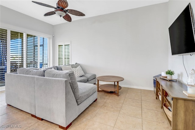 living room with ceiling fan and light tile patterned floors