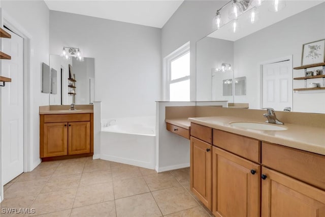 bathroom with vanity, a tub to relax in, and tile patterned floors