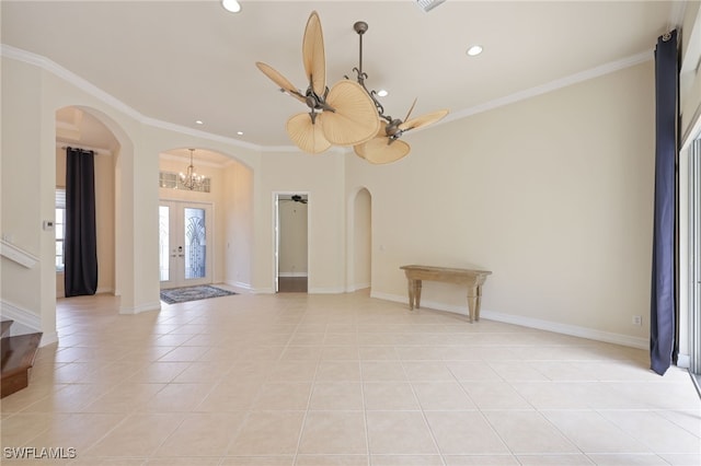 unfurnished room with ceiling fan, french doors, light tile patterned flooring, and ornamental molding