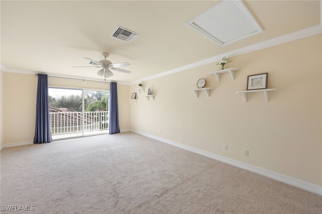 spare room with ceiling fan, ornamental molding, and light colored carpet