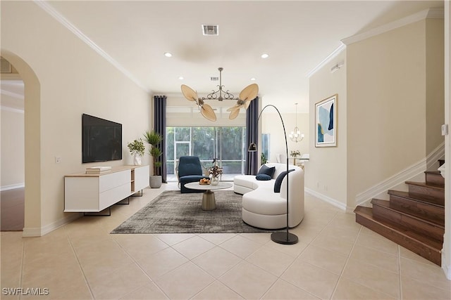 living room with light tile patterned flooring, a chandelier, and ornamental molding