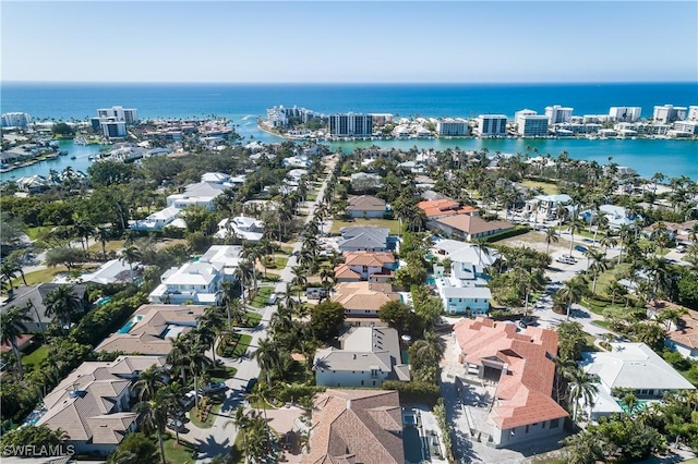 drone / aerial view featuring a residential view and a water view