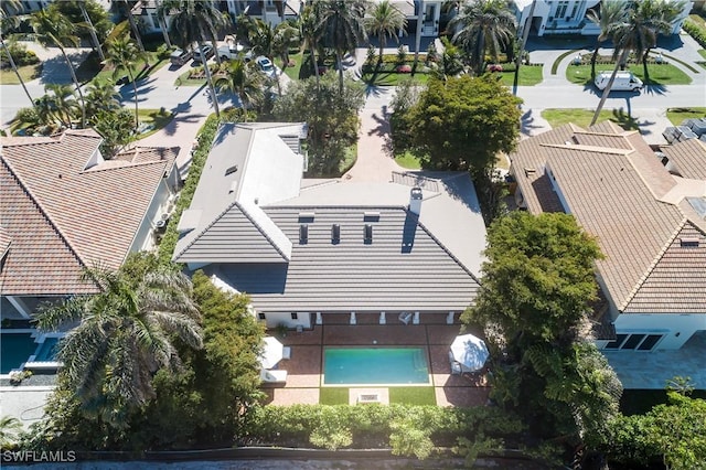 birds eye view of property with a residential view