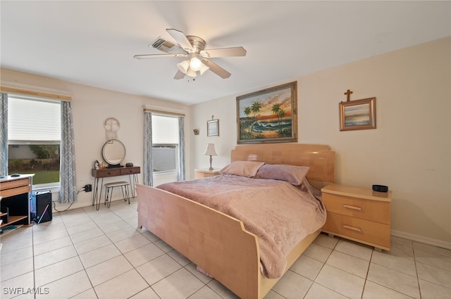 tiled bedroom featuring ceiling fan