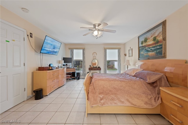 tiled bedroom with ceiling fan