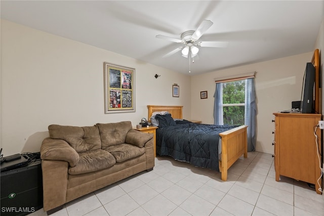 bedroom with ceiling fan and light tile patterned floors