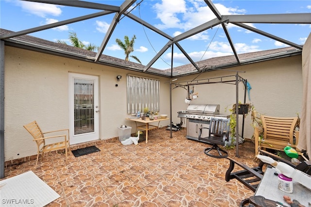 view of patio / terrace with a lanai and area for grilling