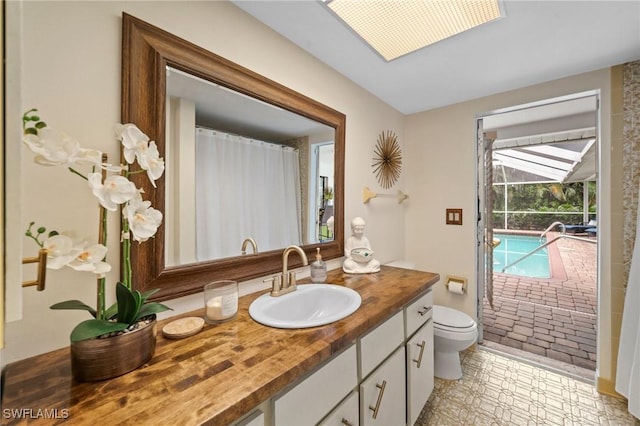 bathroom with vanity and toilet