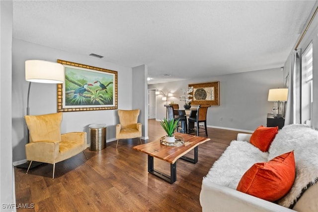 living room with dark hardwood / wood-style floors