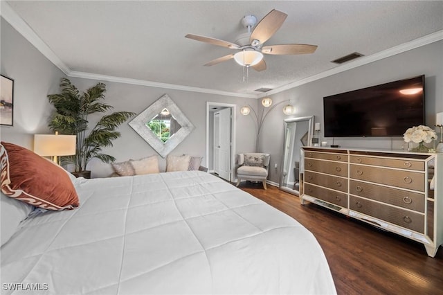 bedroom with dark hardwood / wood-style flooring, ceiling fan, and crown molding