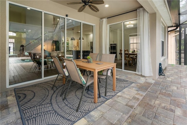 view of patio featuring ceiling fan