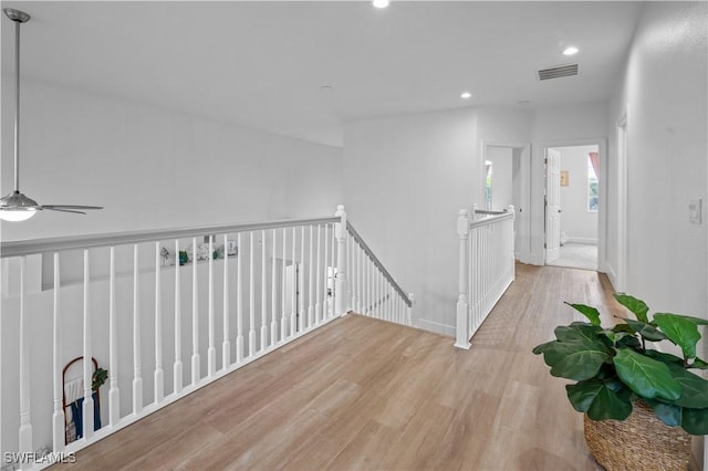 hallway with light hardwood / wood-style flooring