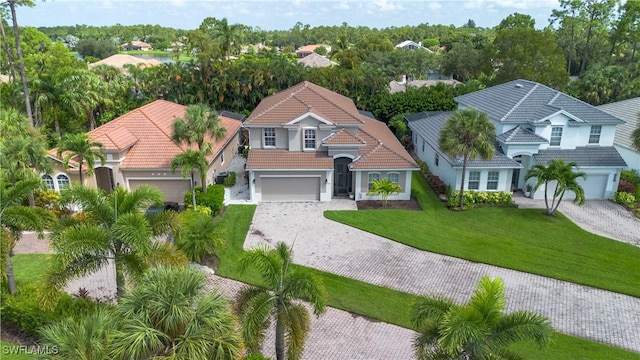 view of front facade with a front lawn and a garage