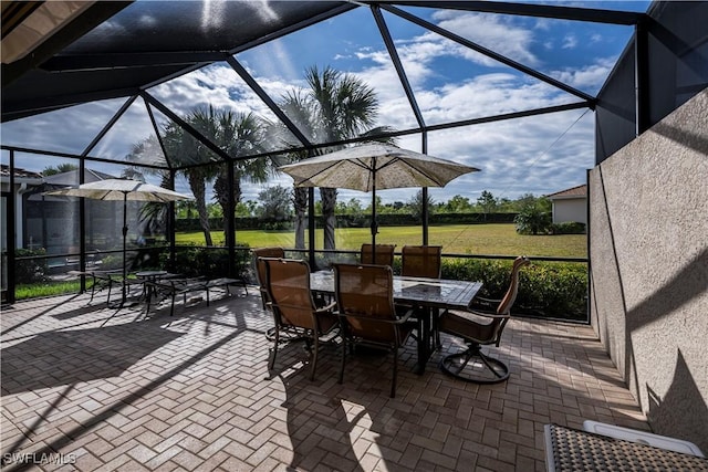 view of patio / terrace featuring glass enclosure