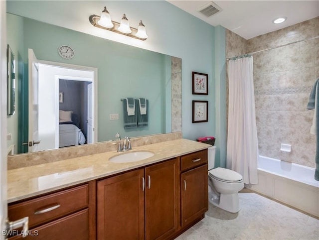 full bathroom featuring tile patterned floors, toilet, vanity, and shower / tub combo with curtain