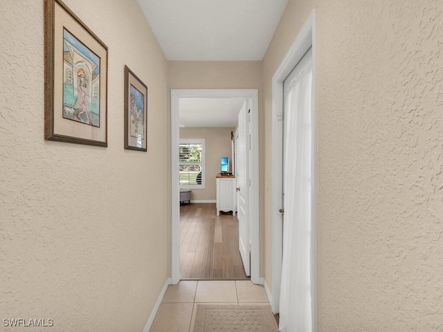 hallway with light tile patterned floors