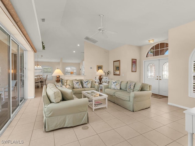 living room featuring ceiling fan, french doors, light tile patterned floors, and a healthy amount of sunlight