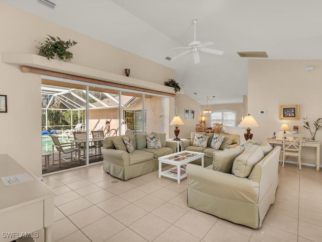 living room with vaulted ceiling, ceiling fan, and light tile patterned flooring